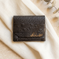 Lil Lizard leather wallet in a warm boutique setting